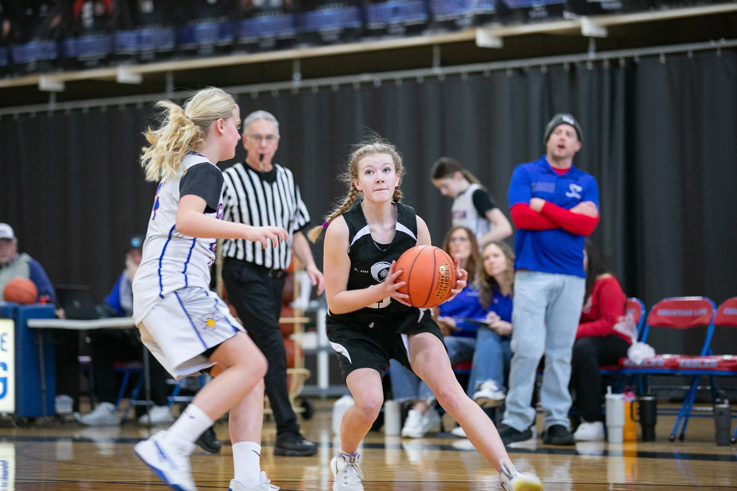 North Star student dribbling basketball during practice